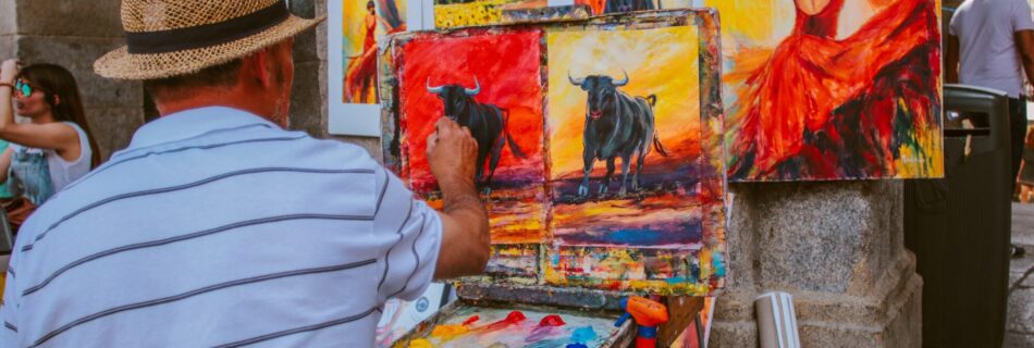 A man who draws an animal in a canvas