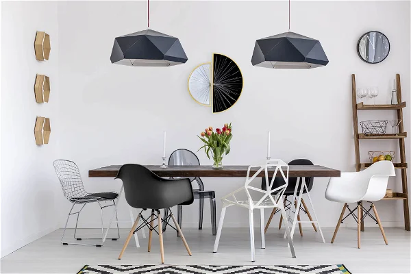 An image of moon metal wall art in half black and half white color