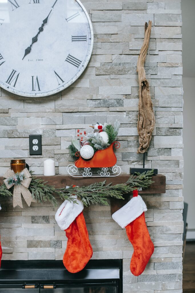 A picture of a large stocking hanging under the Christmas tree or in a window