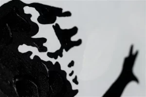 a closer look for the the hand painted face of a girl with a balloon