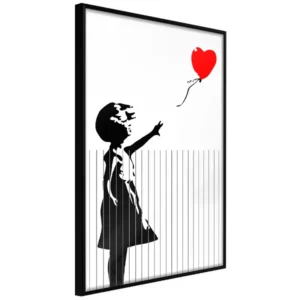 An image of a shredded poster painting of a girl reaching a hear shaped balloon