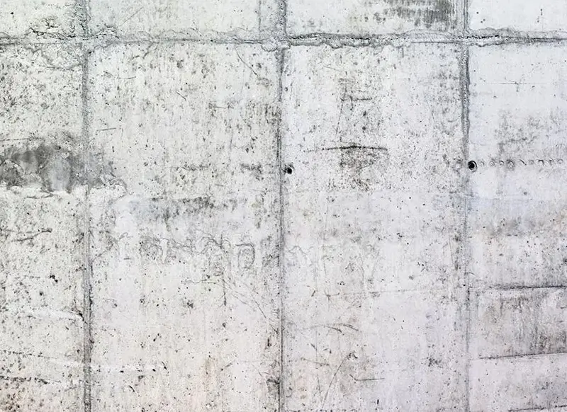 A wallpaper desgn that looks like a concrete wall