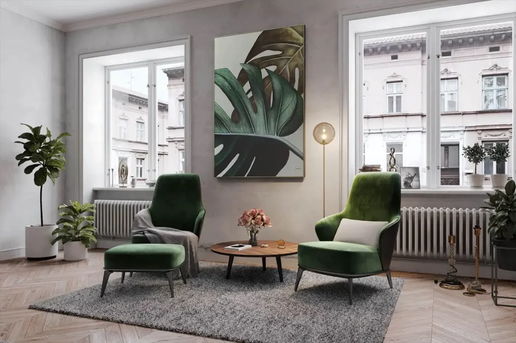 A living room area with a large painting of green leaves