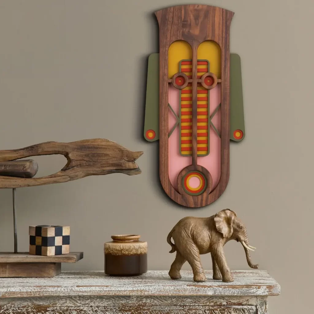 a wooden decorative that looks like a aafrican mask