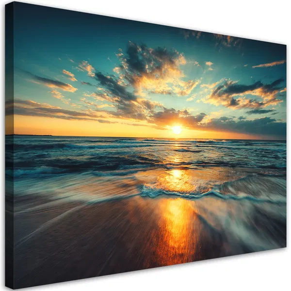 Vibrant sunset over the ocean with waves crashing on the shore, reflecting the colorful sky with dramatic cloud formations.