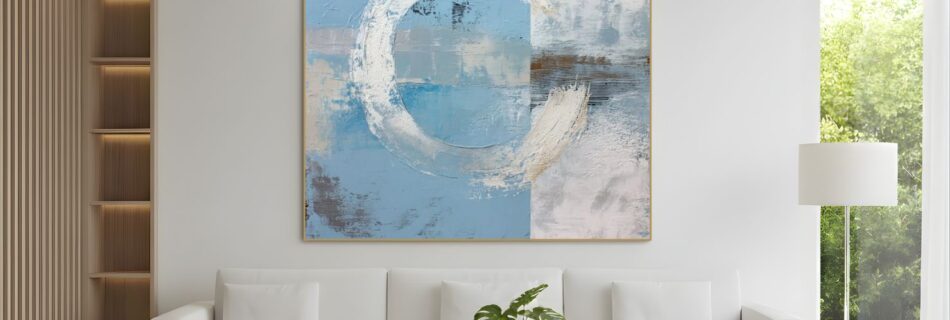 Abstract blue and white circular painting above sofa